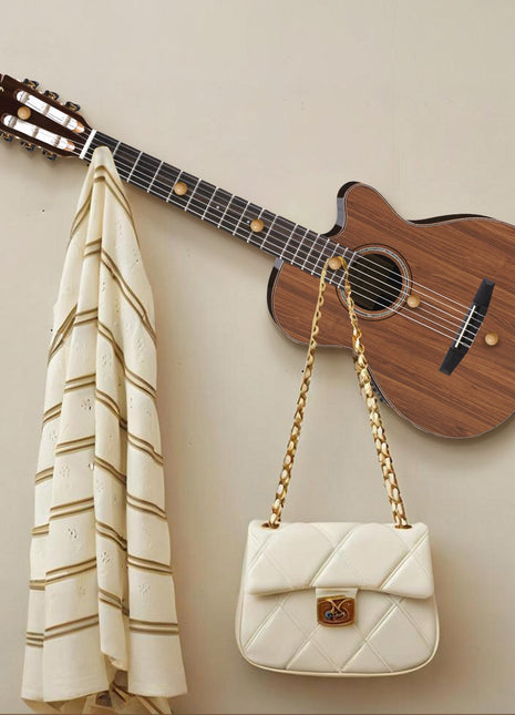 Creative guitar-shaped coat rack decorative painting behind the front key hanger